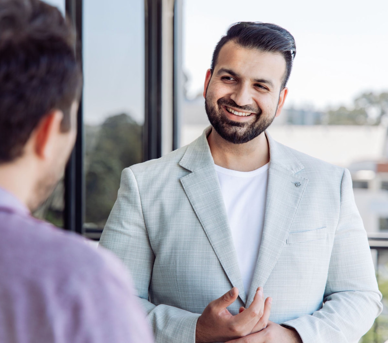 Farooq Ali, Founder of Vested Property Advisory, in conversation with a client.